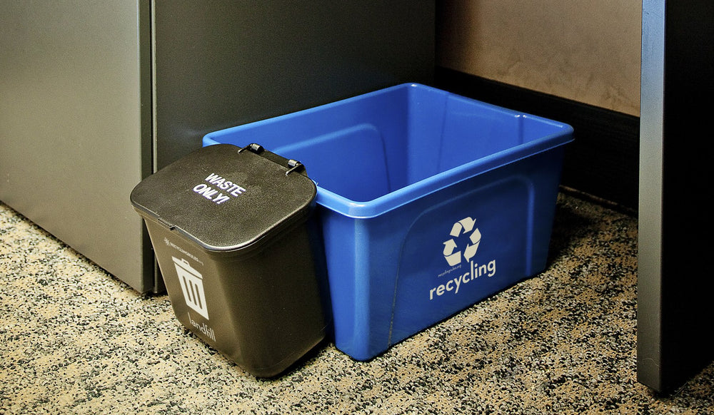 Recycling Rules Hanging Wastebasket mounted inside a cabinet.