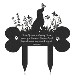Rngmsi dog grave marker shown from the front with its bone-shaped memorial plaque.