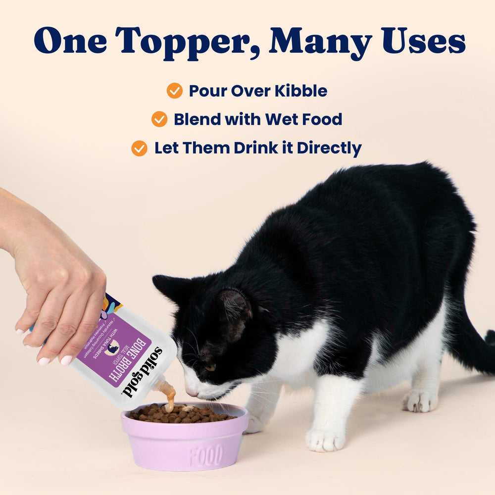 Solid Gold tuna bone broth cat topper shown as a 12-pouch pack.