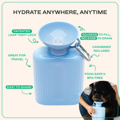 Springland Pets dog water bottle being gently squeezed to fill the bowl.
