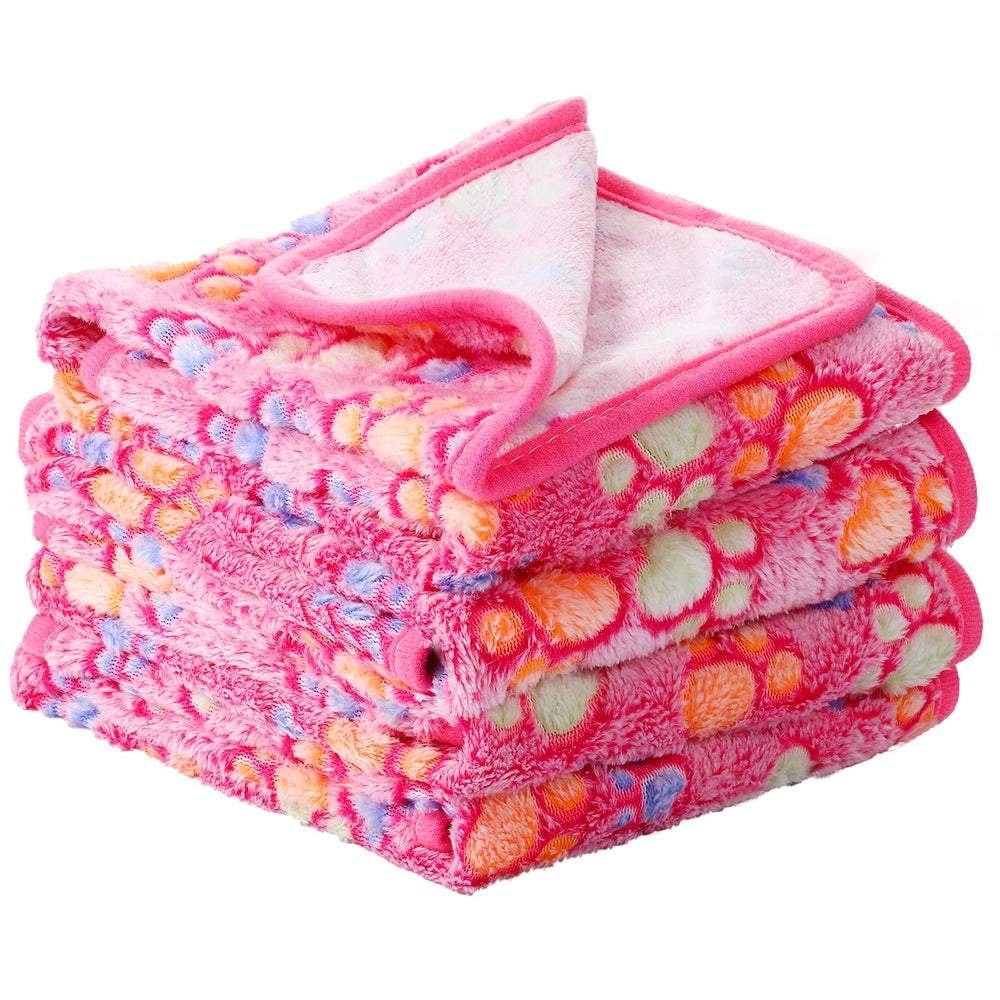 Tatuo fleece pet blankets shown as a four-piece pink paw-print set.