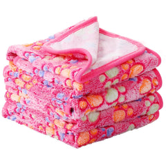 Tatuo fleece pet blankets shown as a four-piece pink paw-print set.