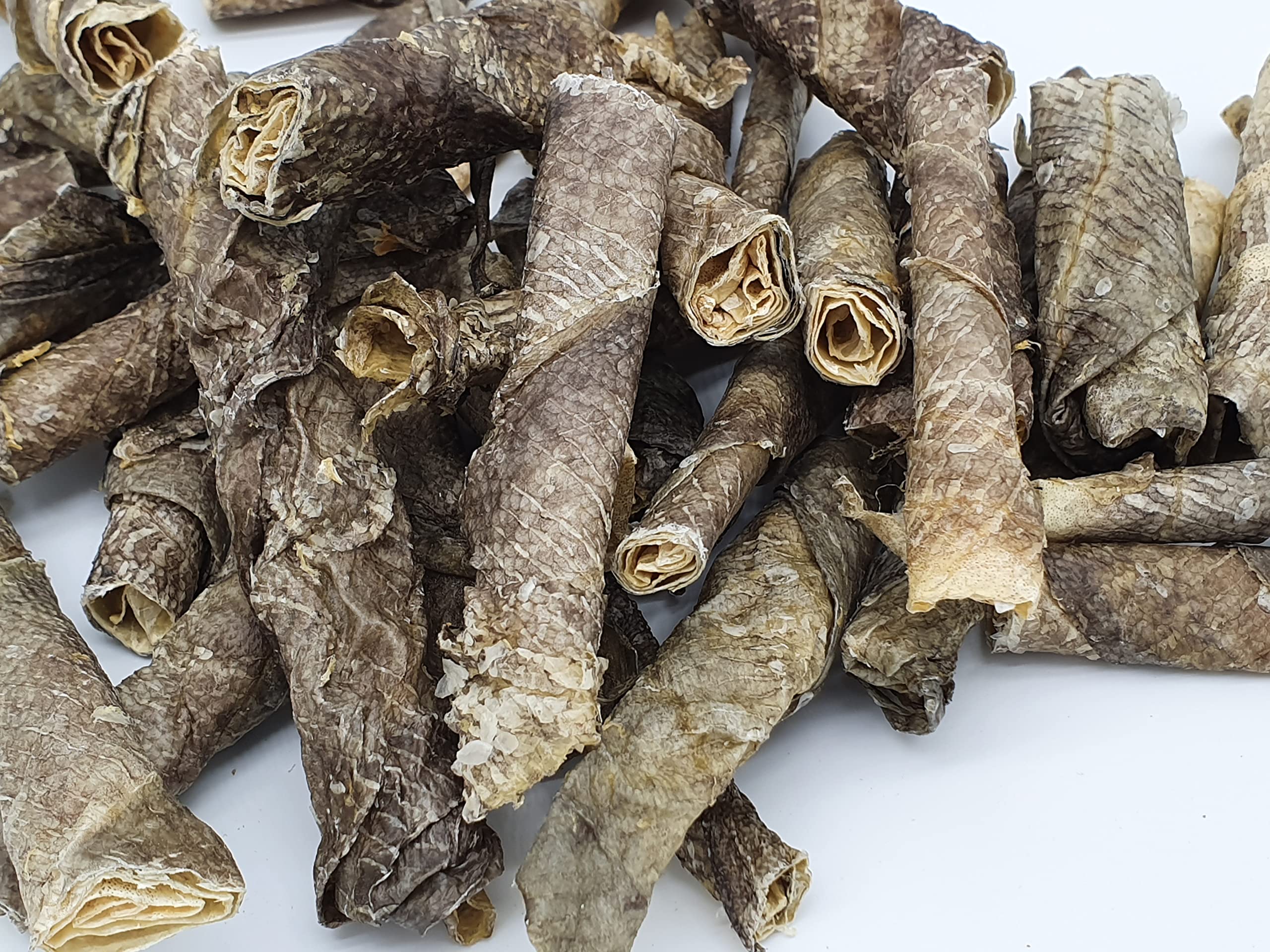 TickledPet cod skin dog treats highlighting the twisted chew shape.