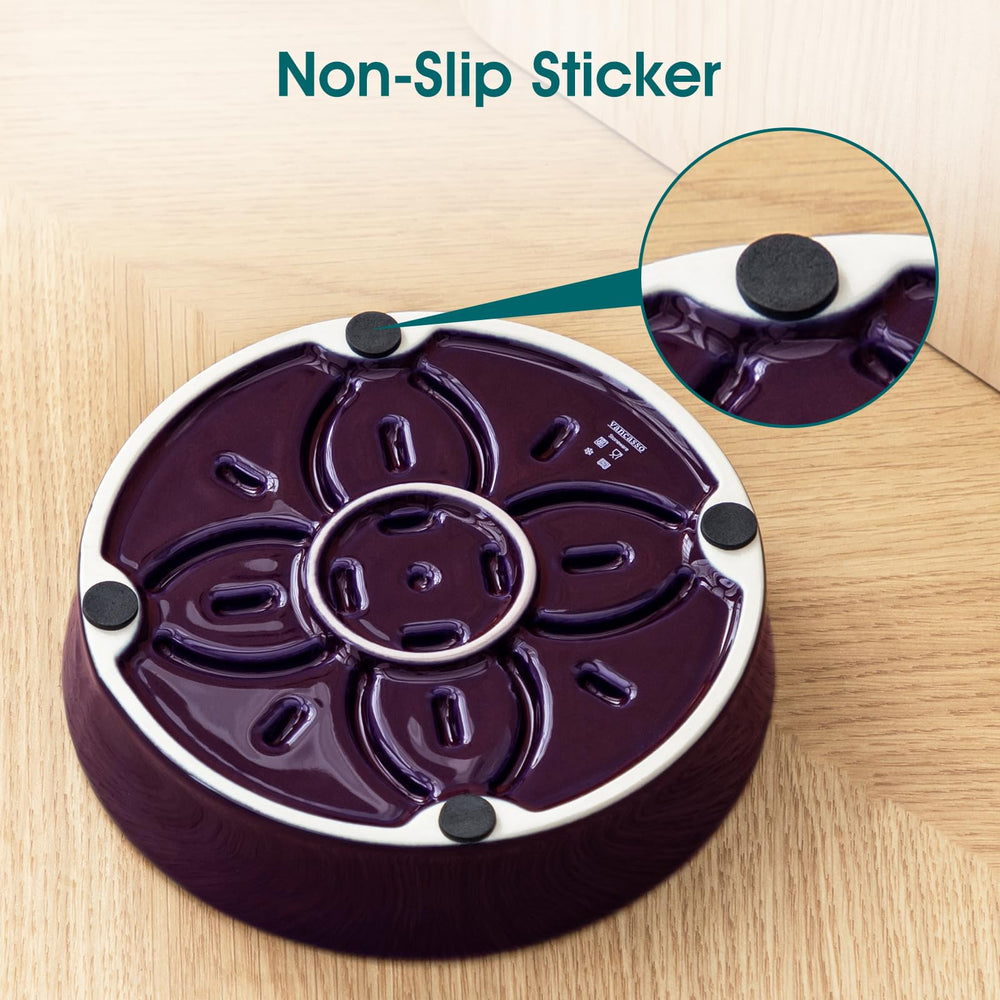 Non-slip pads beneath the purple vancasso Slow Feeder Dog Bowl.