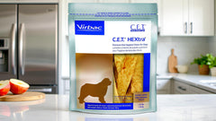 Virbac C.E.T. HEXtra large oral hygiene chews shown beside their bag.