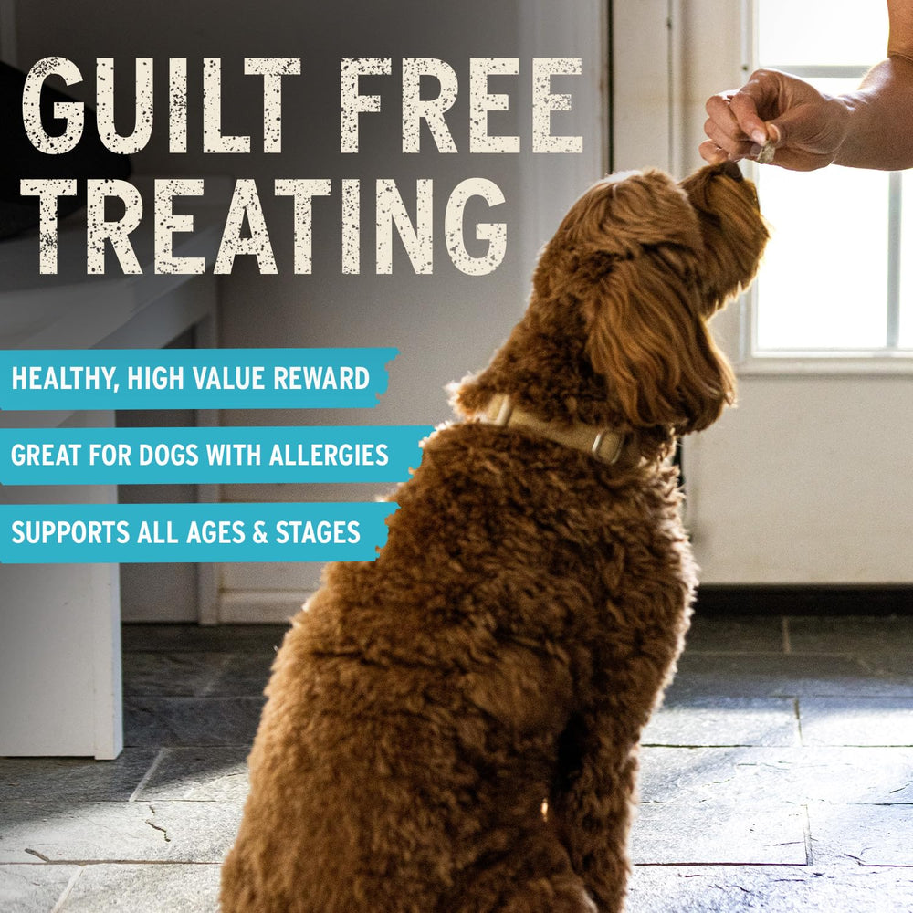 A dog receives a Vital Essentials rabbit dog treat as a reward.